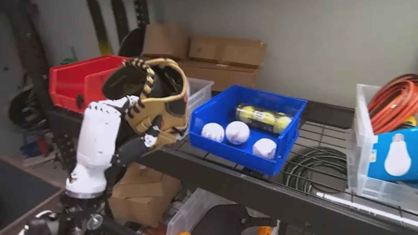 A robot handling a baseball glove in Google DeepMind's Gemini Robotics ER 2 demonstration
