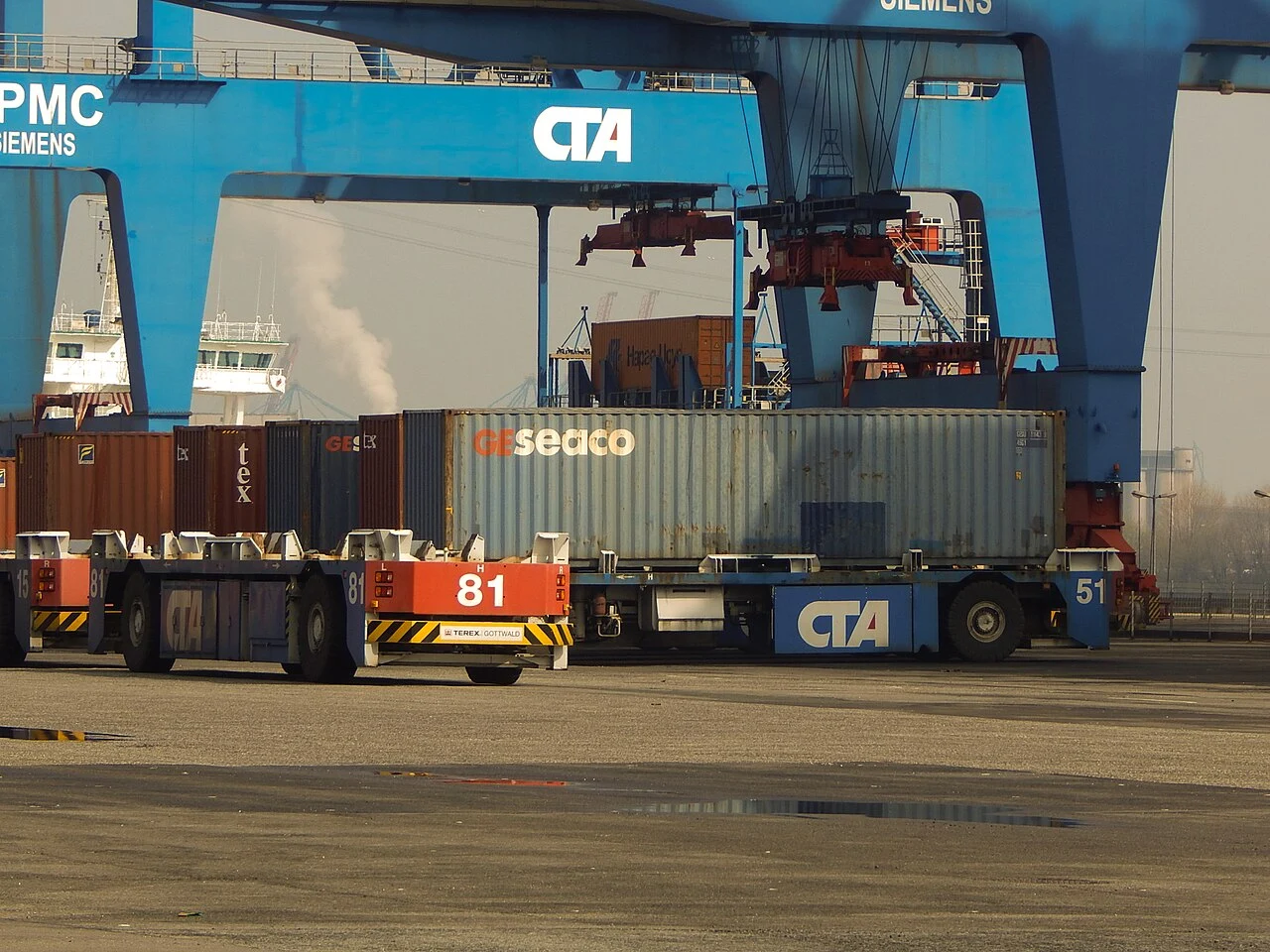 Automated vehicles transporting shipping containers